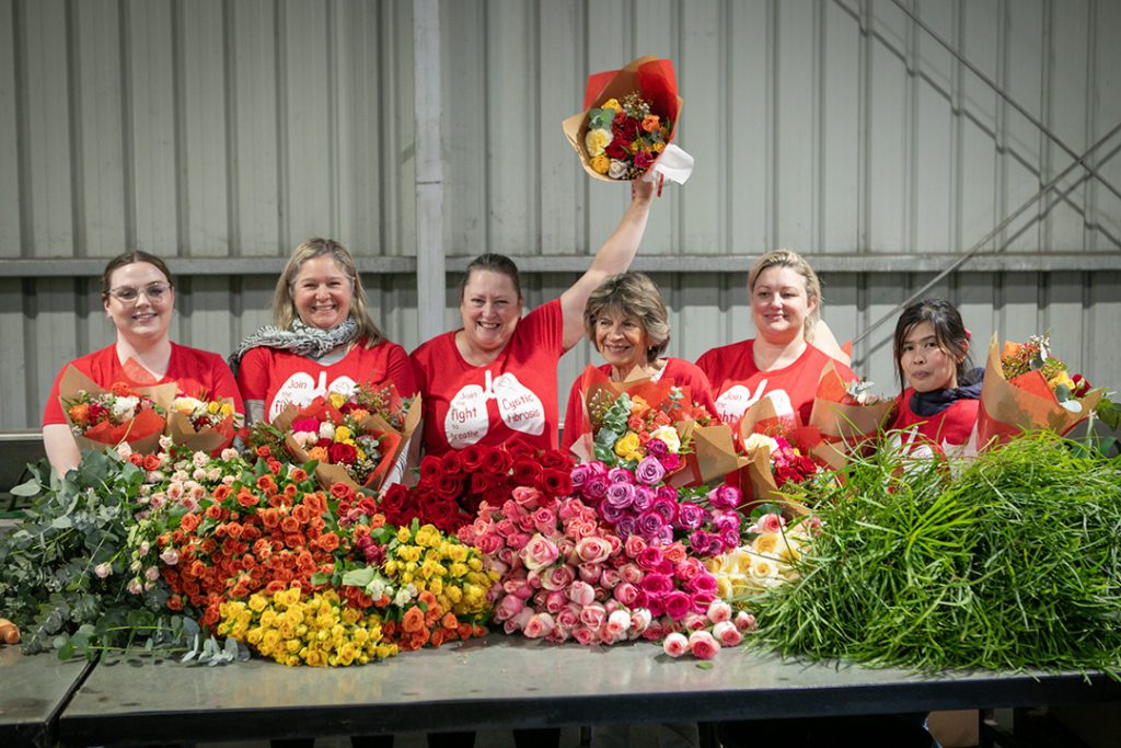 Wafex Australia staff holding bouquets